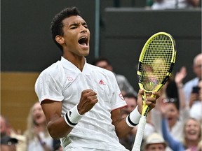 Felix Auger-Aliassime reacts after beating Germany's Alexander Zverev in their men's singles fourth round match on the seventh day of the 2021 Wimbledon Championships at The All England Tennis Club in Wimbledon, southwest London, on July 5, 2021.