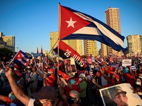 Cubans participate in an act of revolutionary reaffirmation to support the government of President Miguel Diaz-Canel in Havana on Saturday, July 17, 2021. Former Cuban president Raul Castro and his successor, Miguel Diaz-Canel, led an "act of revolutionary reaffirmation" in front of thousands of supporters in Havana on July 17, six days after the historic protests that shook the country.
