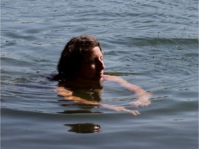 Verdun city councillor Marie-Andrée Mauger swims in the St. Lawrence River in 2014 to promote the creation of a public beach. She will run for borough mayor under the Projet Montréal banner in November.