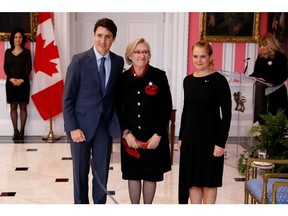 Carolyn Bennett poses with Prime Minister Justin Trudeau and then-governor general Julie Payette after being presented as Minister of Crown-Indigenous Relations on Nov. 20, 2019. Payette is gone, and Bennett is in hot water.