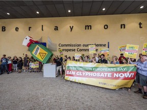 Protesters demonstrate against at European Union headquarters on Wednesday, July 19, 2017, in Brussels, Belgium. Use of glyphosate is currently approved in the EU, but the herbicide has been the subject of controversy and lawsuits because it is a suspected carcinogen.