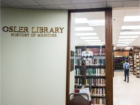 A woman walks through the Osler Library of History of Medicine at the McGill University Faculty of Medicine McIntyre Medical Building in Montreal in 2013. "Osler’s ashes rest in an urn in the Osler Library of Medicine at McGill University, perhaps the most appropriate final resting place for one of McGill’s most famous graduates," Joe Schwarcz writes.
