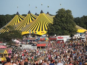 Festivalgoers enjoy the weather and stalls at the Latitude Festival at Henham Park, Britain, on July 22, 2021.