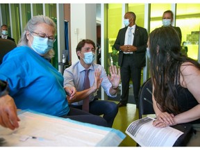 Prime Minister Justin Trudeau visits a vaccination clinic in Montreal's St-Michel neighbourhood this morning.