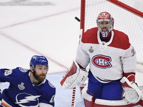 Montreal Canadiens goaltender Carey Price (31) and Tampa Bay Lightning right wing Barclay Goodrow (19) watch the puck. The Stanley Cup final is Price's legacy moment.