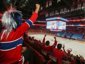 Montreal Canadiens hockey fans react as they watch the second away game of the Stanley Cup Finals, against Tampa Bay Lightning, at Bell Centre in Montreal, Quebec, Canada June 30, 2021.  REUTERS/Christinne Muschi
