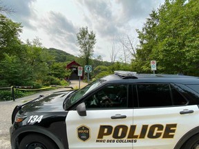 Police and emergency crews search for a man in the Gatineau River near Wakefield, Quebec.