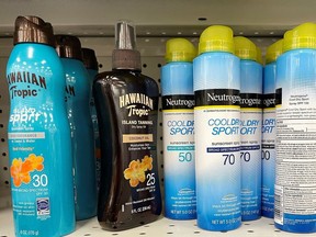 Johnson & Johnson's Neutrogena Cool Dry Sport sunscreen, which is part of a voluntary recall of five Neutrogena and Aveeno brand aerosol sunscreen products after a cancer-causing chemical was detected in some samples, sits on a shelf at a store in Gloucester, Mass., on July 15, 2021.