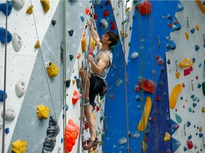 German sport climber and Tokyo Olympics competitor Jan Hojer trains in a climbing hall in Hilden, Germany in June. There’s a mental component to the sport, with climbers assessing the course and choosing a route that plays into their strengths.
