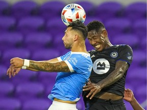 New York City midfielder Valentin Castellanos and CF Montréal forward Romell Quioto go for the header during the first half at Exploria Stadium on Wednesday, July 7, 2021.