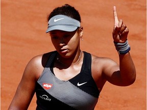 Japan's Naomi Osaka reacts during her first-round match against Romania's Patricia Maria Tig at the French Open in Paris on May 30, 2021.