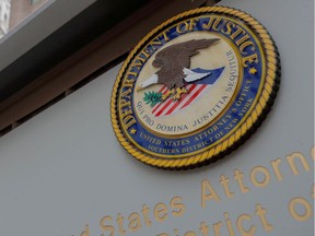 The seal of the United States Department of Justice is seen on the building exterior of the United States Attorney's Office of the Southern District of New York in Manhattan, New York City, U.S., Aug. 17, 2020.