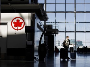 Air Canada reported a smaller second-quarter loss on Friday.