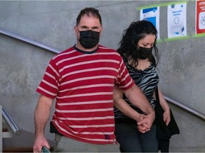 Guy Dion and Marie-Josée Viau are charged with the 2016 murders of brothers Vincenzo and Giuseppe Falduto. The couple are seen entering the Gouin courthouse in Montreal on May 27, 2021.