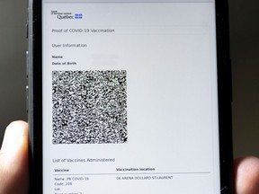A cell phone displaying the QR code proof of vaccination sent to every Quebecer who has been vaccinated against COVID-19, in Montreal Thursday July 22, 2021. (NOTE: image has been digitally altered to protect private information)