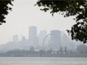 A haze and smog filled skyline of Montreal as seen from Ile-Sainte-Hélène, on Monday, July 26, 2021. On Tuesday, temperatures hit 38 C with the humidex by noon.