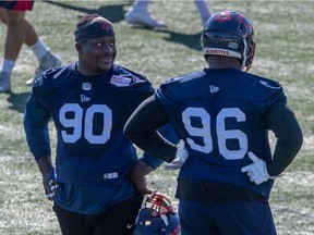 Almondo Sewell, left, and Michael Wakefield, chat during Alouettes practice at the Olympic Stadium in Montreal on July 28, 2021.