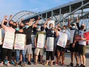 Canada Border Services Agency workers represented by the Public Service Alliance of Canada began work-to-rule job action Friday morning at border crossings and airports across the county. Several union members gathered Friday morning near the Blue Water Bridge in Point Edward to support the job action. An eleventh-hour deal with Ottawa Friday night avoids further strike actions.