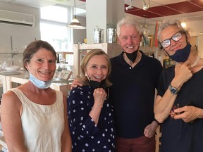 In a now-deleted Facebook photo from the Town of Sutton, Bill and Hillary Clinton are seen with Louise Penny at l'Atelier Bouffe.