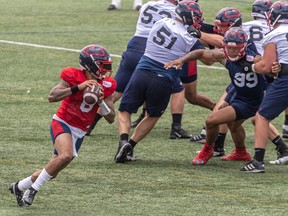 Quarterback Vernon Adams Jr. rolls out during Alouettes practice at Olympic Park earlier this month.