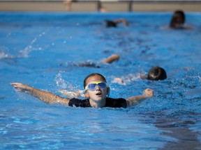 Julia, 9, does laps at Westminster Pool in Dollard-des Ormeaux on Tuesday morning. The outdoor pool is marking its 50th anniversary with some special events this Saturday, including carnival games and a family supper. The pool has several current members in the 60-80 age group who were members when the pool first opened. (