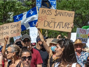Protesters march to express their disagreement with Quebec's vaccination passport, which they are calling "highly discriminatory", in Montreal on Saturday August 14, 2021.