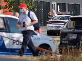 Montreal police investigators sealed off a site near the MUHC on Aug. 24, 2021 after gunshots were heard overnight and an officer was injured.