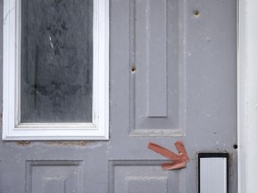 All police found when they investigated reports of gunfire on Notre-Dame St. in St-Henri early on Wednesday was a door riddled with seven bullets.