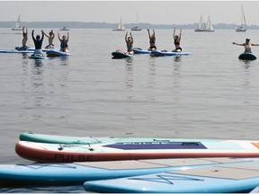 The sweltering heat couldn't stop members of Pop Spirit to do their paddleboard yoga off the shore of Pointe-Claire on Saturday.