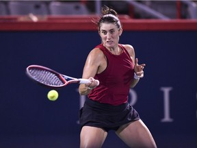 Vancouver's Rebecca Marino hits a return during her first-round match against Madison Keys of the U.S. on Day 1 of the National Bank Open at IGA Stadium on Aug. 9, 2021, in Montreal.