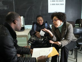 Maison Haiti in St-Michel district has become the nerve centre for the local response to the earthquake tragedy with all kind of services offered.Here is (right) Marjorie Villefranche, Program director talking to left, Philogène Jean-Murat and middle is Ursule Demosthène.