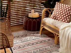 Outdoor carpets, soft pillows, screens, drapes and candlelight are ways to create a warm and inviting patio on cool autumn nights. Artefact vinyl rug, $90, Simons.ca