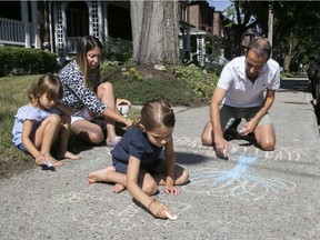 Maya Angenot with her husband, Horia Bundaru, and their two daughters, five-year-old Éloïse, left, and seven-year-old Ariane. The kids make good use of the sidewalk in front of their N.D.G. home.