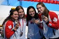 Bronze medallists (from L) Canada's Kylie Masse, Canada's Sydney Pickrem, Canada's Margaret MacNeil and Canada's Penny Oleksiak pose with their medals after the final of the women's 4x100m medley relay swimming event during the Tokyo 2020 Olympic Games at the Tokyo Aquatics Centre in Tokyo on August 1, 2021. (Photo by Jonathan NACKSTRAND / AFP) (Photo by JONATHAN NACKSTRAND/AFP via Getty Images)