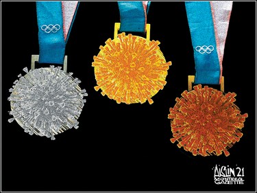 Gold, silver and bronze medals made to look like COVID under a microscope