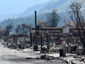 The charred remnants of homes and buildings, destroyed by a wildfire on June 30, are seen during a media tour by authorities in Lytton, British Columbia, Canada July 9, 2021.