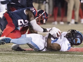 "We're trying to disguise a lot of things and be aggressive on the field," said linebacker Chris Ackie, seen tackling Argonauts' S.J. Green in 2019. "The offence won't know what defence we're in or feel comfortable."