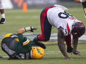 Montreal Alouettes' Almondo Sewell sacks Edmonton Elks quarterback Trevor Harris during second-half CFL action in Edmonton, Alta., on Saturday, Aug. 14, 2021.