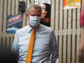 New York Mayor Bill de Blasio arrives at a coronavirus disease (COVID-19) vaccination clinic at Lehman High School in the Bronx borough of New York City, New York, U.S., July 27, 2021. REUTERS/David 'Dee' Delgado