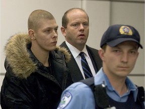 Sébastien Simon, left, is seen being escorted by police at Trudeau airport in 2006.