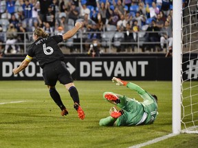 CF Montréal midfielder Samuel Piette celebrates after scoring a goal against Toronto FC goalkeeper Quentin Westberg during the first half at Stade Saputo Friday night.