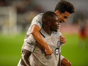 CF Montréal defender Zachary Brault-Guillard (15) celebrates his goal with teammate Joaquin Torres (18) during the first half against D.C. United at Audi Field in Washington, D.C., on Sunday, Aug. 8, 2021.