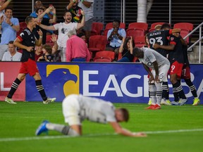 United forward Ola Kamara (9) and D.C. United defender Tony Alfaro (93) celebrate a goal as CF Montreal players dejectedly react during the second half at Audi Field.