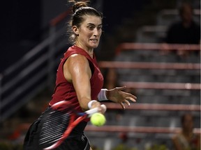 Toronto's Rebecca Marino of Canada hits a shot against Madison Keys of the United States during first-round play at the National Bank Canadian Open.