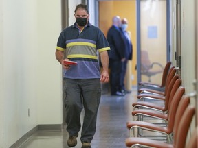 Co-accused Guy Dion walks through the hall during a break in his murder trial with Marie-Josée Viau at the Gouin courthouse in Montreal on May 31, 2021.