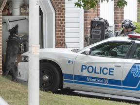 Montreal's SWAT team prepares to enter a Dollard-des-Ormeaux residence after a home-invasion report Aug. 28, 2021. Several homes in the area were evacuated during the search, but it turned out the intruder was not inside.