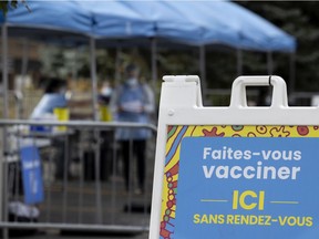 Health care workers man a COVID-19 vaccination pop up centre at the Atwater Market Sept. 2, 2021.
