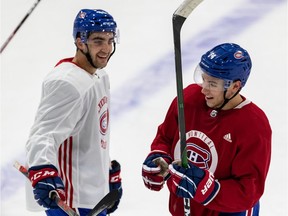 Josh Brook and Nik Suzuki, right, chat during the Montreal Canadiens' rookie camp at the Bell Sports Complexe in Brossard on Sept. 6, 2019.