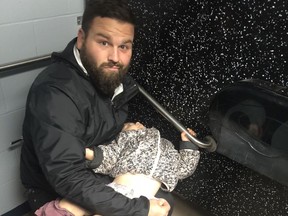 Benoit Langevin is pictured here trying to change his daughter's diaper in 2018. Today, the Pierrefonds-Roxboro councillor welcomes the addition of new baby changing tables in the men's and
people with reduced mobility public washrooms, within its municipal buildings, in order to
allow both moms and dads to change their babies' diapers in a proper environment.