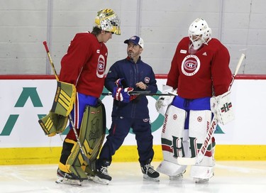 Laval Rocket goalie coach Marco Marciano looks up at 6'6" goalie Joe Vrbetic as Alexis Gravel listens on the first day of Montreal Canadiens' rookie camp at the Bell Sports Complex in Brossard on Thursday, September 16, 2021.